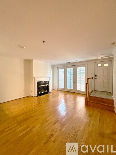 A white laundry room with a washer and dryer.