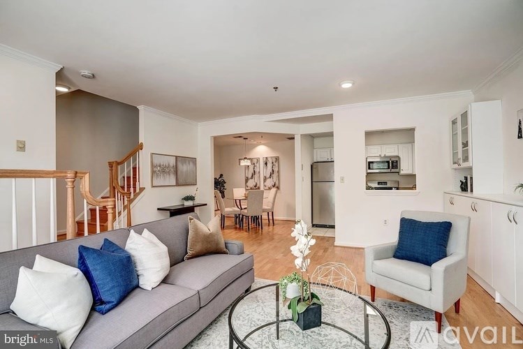 A living room with a grey couch and a coffee table.