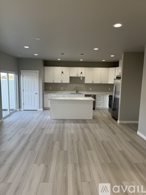 A modern kitchen with a large island in the middle.