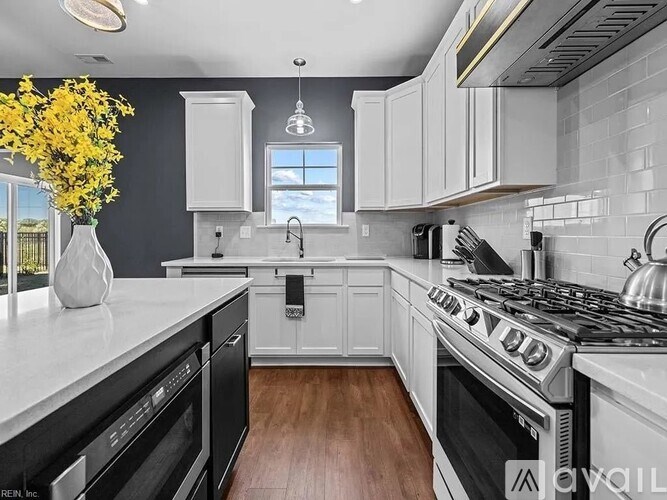 A modern kitchen with a black and white color scheme.