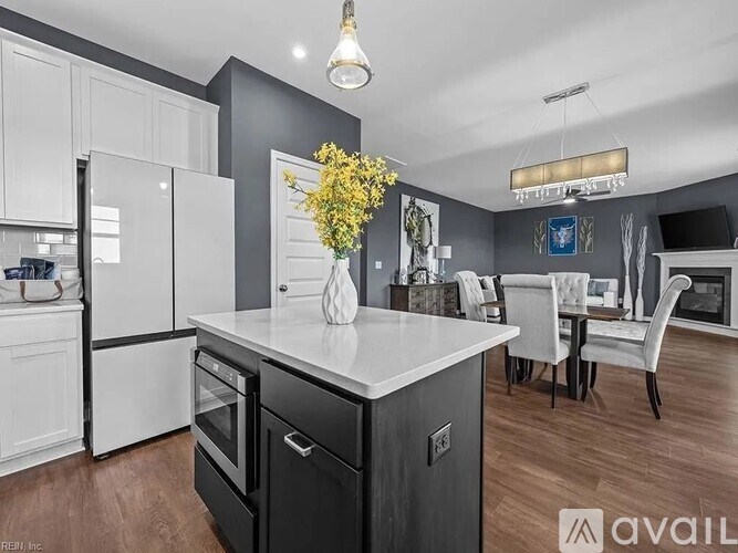 A modern kitchen with a black and white color scheme.