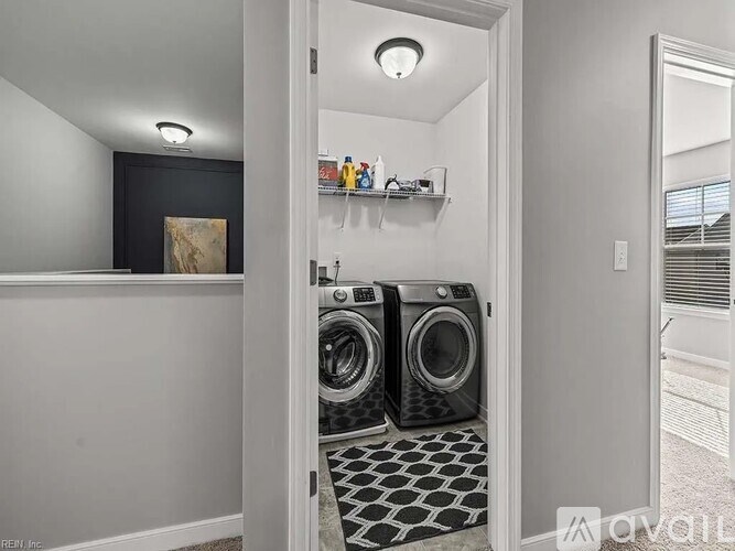 A laundry room with a washer and dryer.