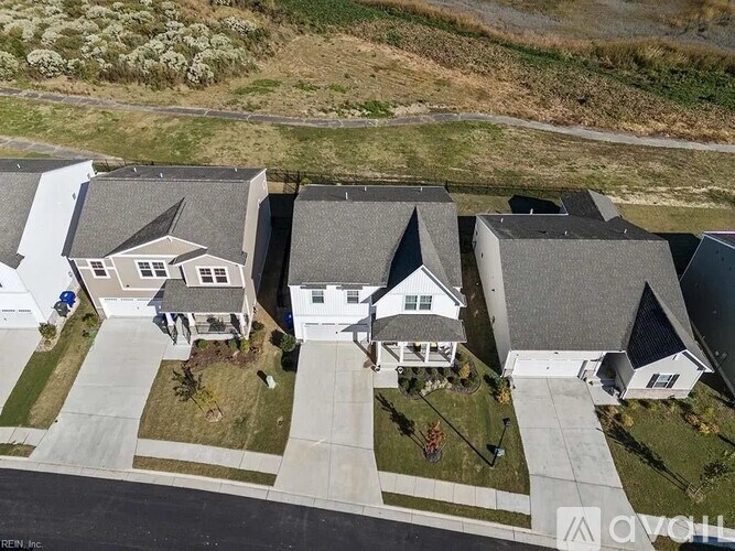 A row of houses with a white fence in between them.