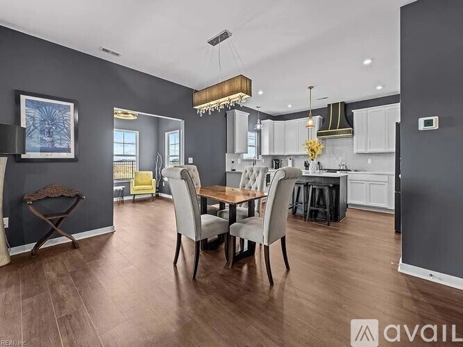 A modern kitchen with a dining table set up.