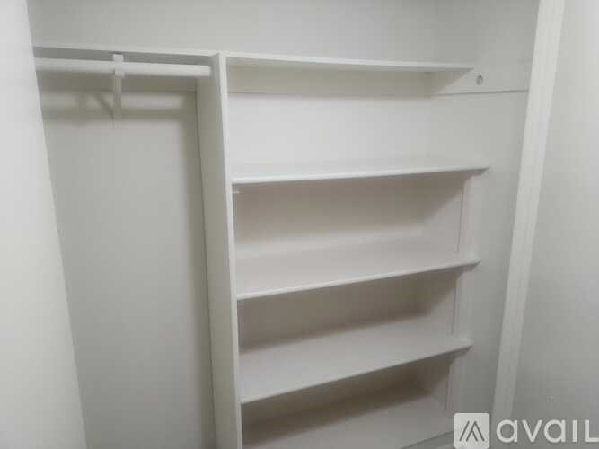 Empty white shelves in a room.
