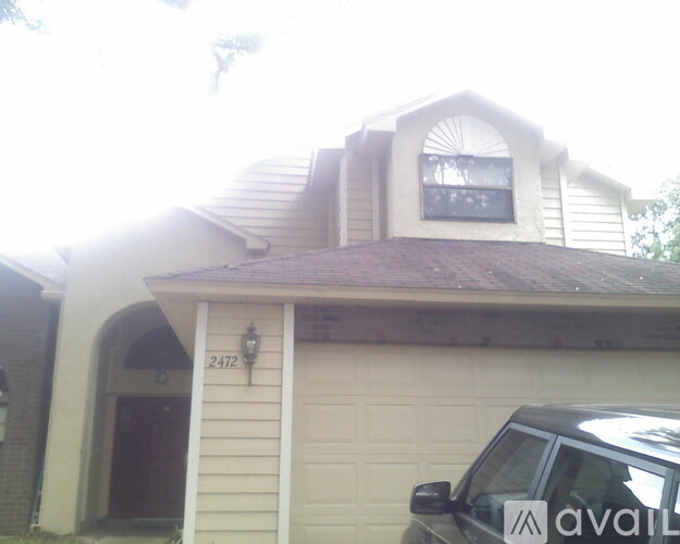 A house with the number 2412 on the front door.
