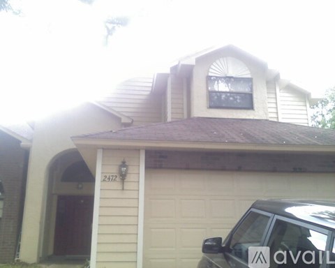 A house with the number 2412 on the front door.