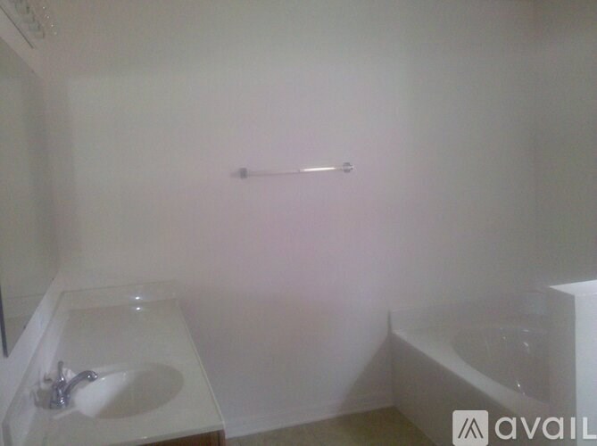 A bathroom with a sink and a bathtub.