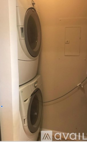 Two washing machines stacked on top of each other.