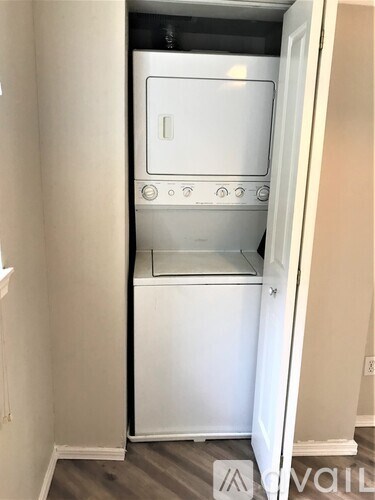 A white oven is built into a wall.