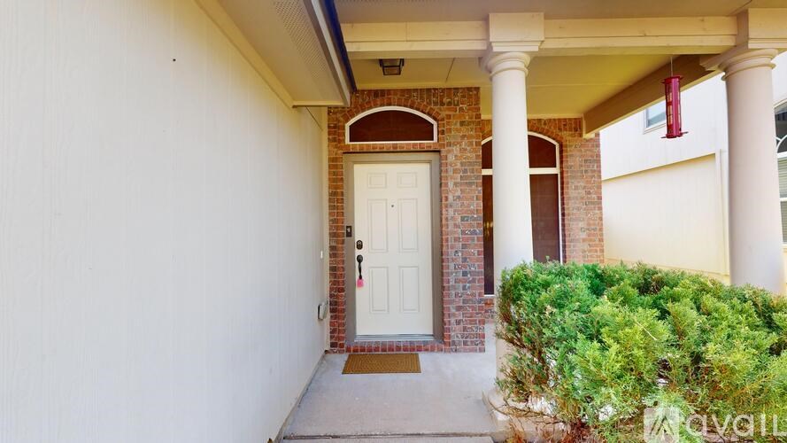 A white bathroom with a toilet, sink, and bathtub.