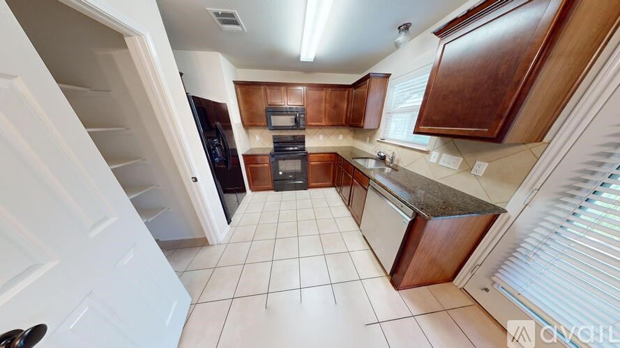 A room with two doors and a carpeted floor.