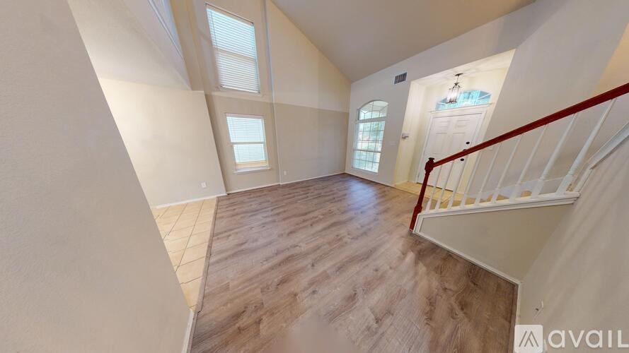 A bathroom with a toilet, sink and mirror.