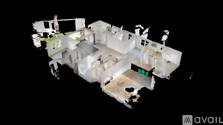 A 3D model of a house with a green square in the middle of the living room.