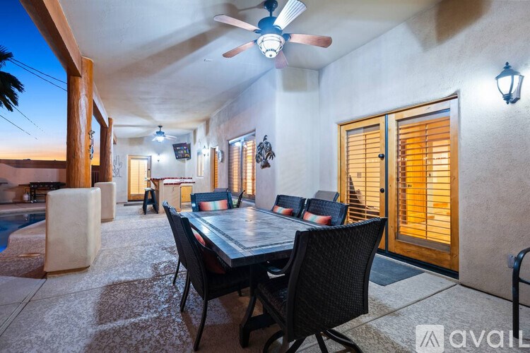 A patio with a table and chairs is available for rent.