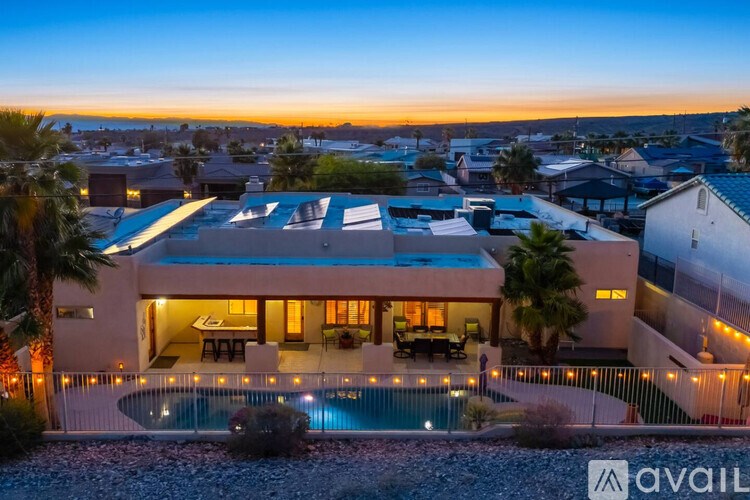 A modern house with a pool in the backyard.