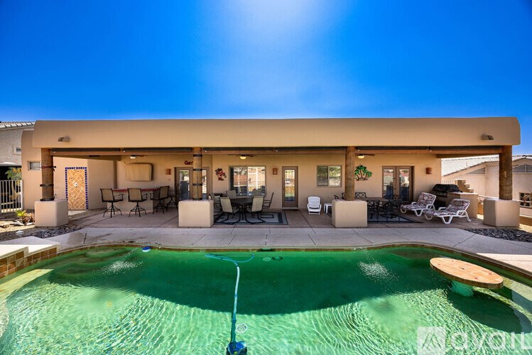 A house with a pool in the backyard.