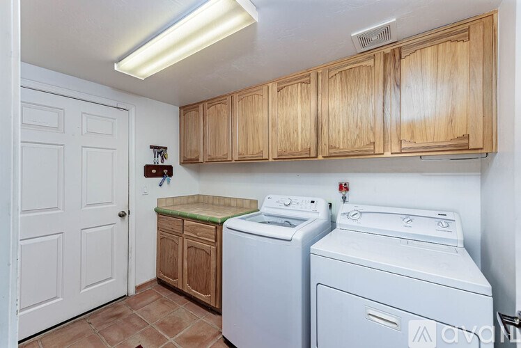 A laundry room with a washer and dryer.