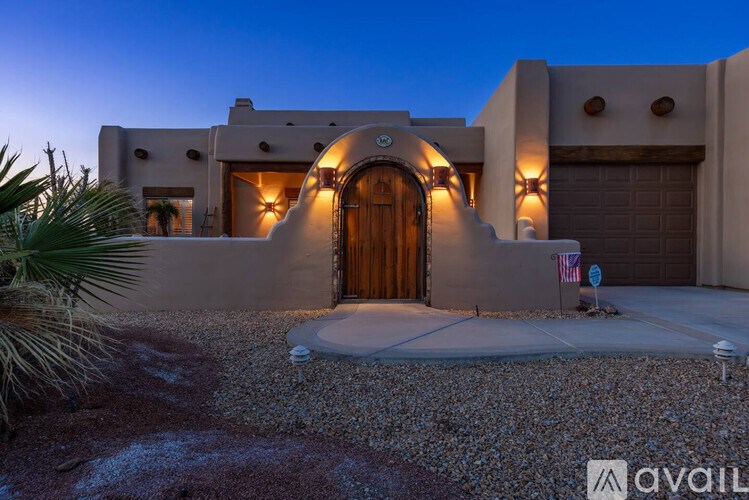 A house with a large wooden door and a flag on the front.
