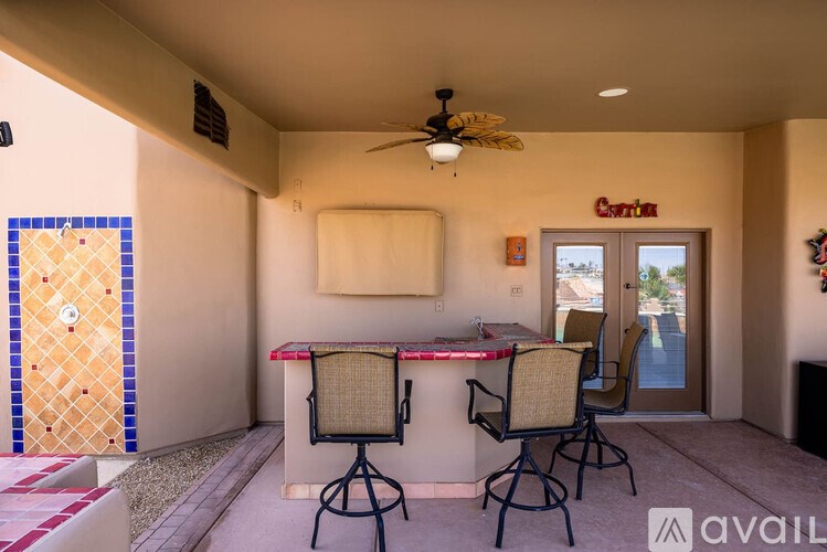 A patio with a bar and chairs is available for rent.