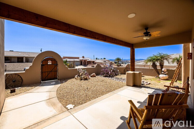 A patio with a chair and a table is available for rent.