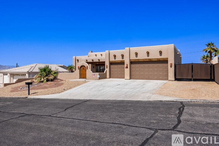 A modern house with a brown garage door is available for sale.