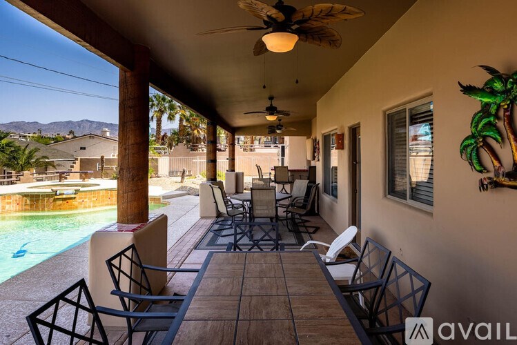 A patio with chairs and a table is available for rent.
