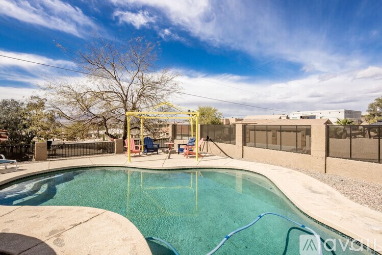 A pool with a blue hose in it.
