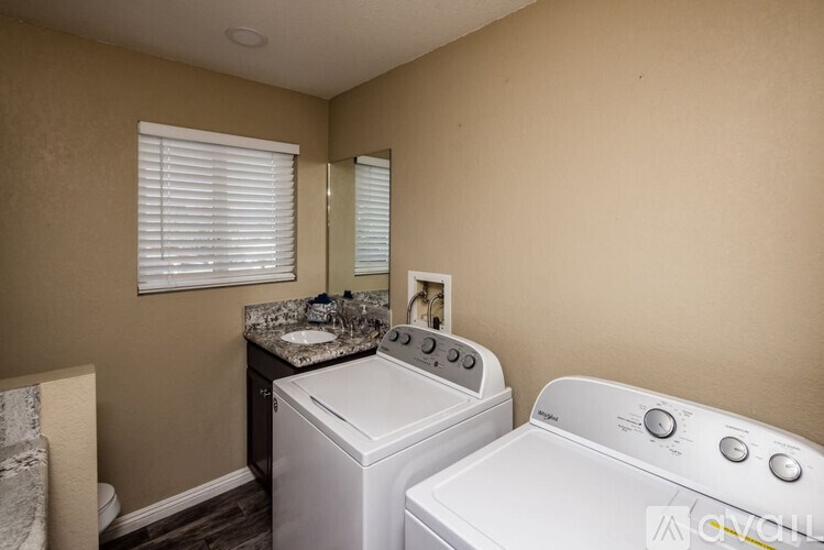 A laundry room with a washer and dryer.