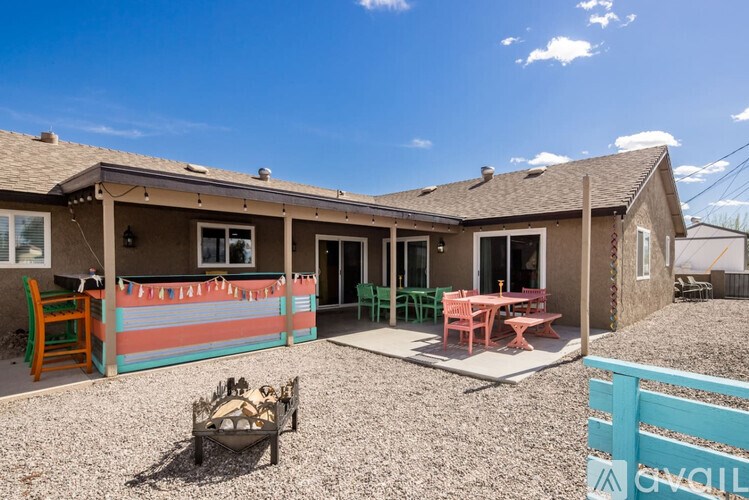 A house with a patio and a chair set.