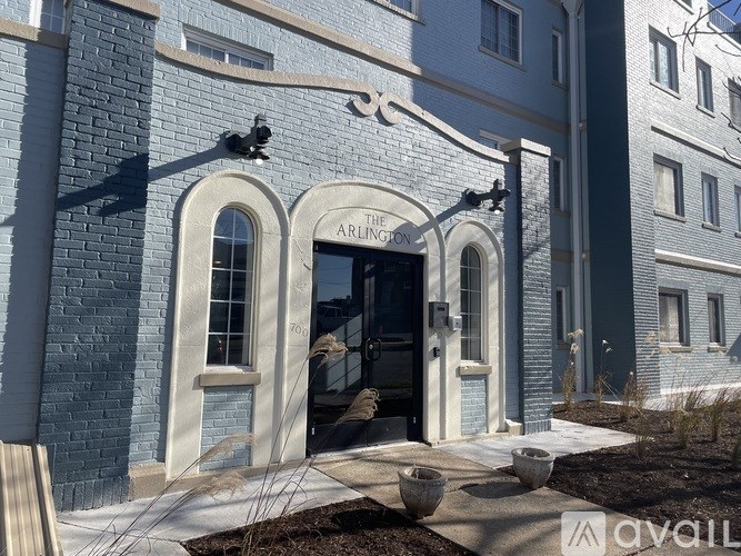 The entrance to The Arlington building is shown.