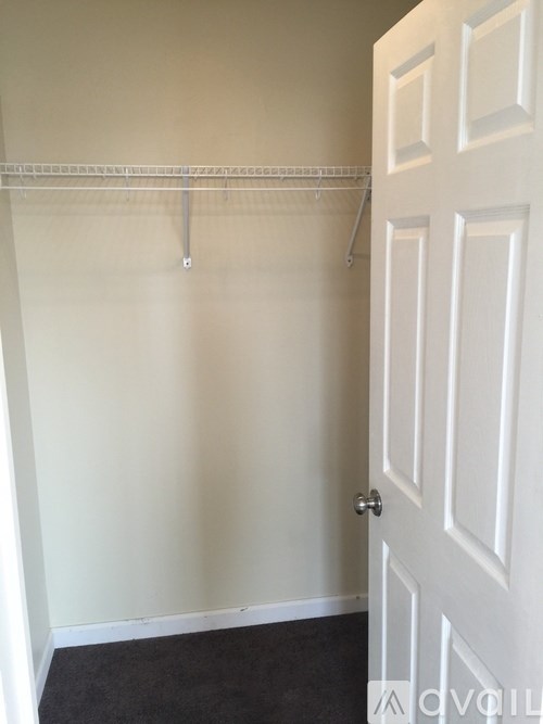 A white door is on the right side of the image.