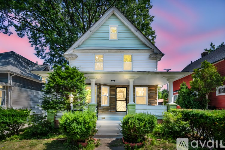 A house with a front yard and a porch.