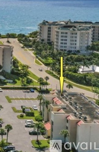 A parking lot with cars and a yellow arrow pointing to the right.