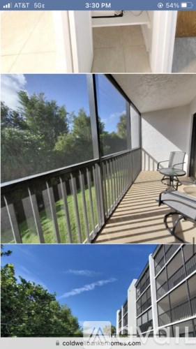 A balcony with a chair and a table is shown.