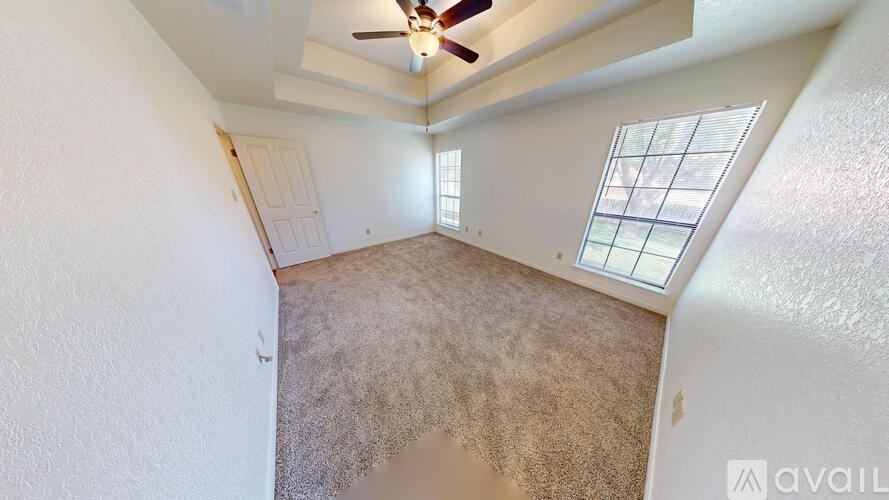 A bathroom with a toilet, sink, and shower.