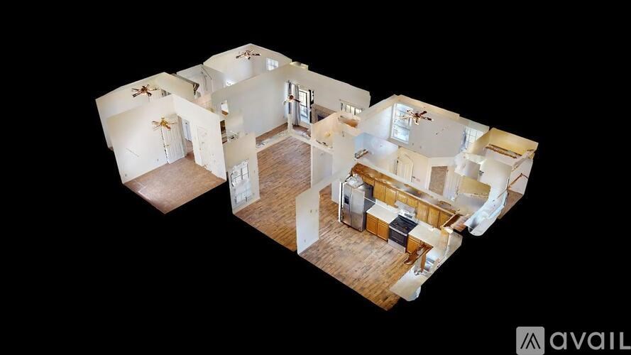A 3D image of a house interior with a kitchen, living room, and two bedrooms.