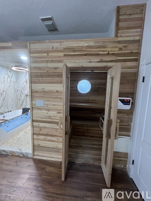 A wooden structure with a round window in the middle.