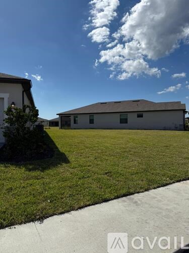 A house with a lawn in front of it.