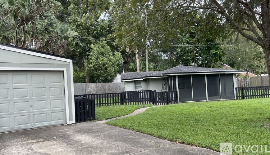 A house with a garage is for sale.