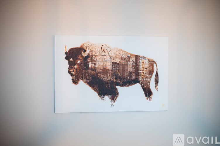 A bison silhouette is filled with a pattern that resembles a cityscape.