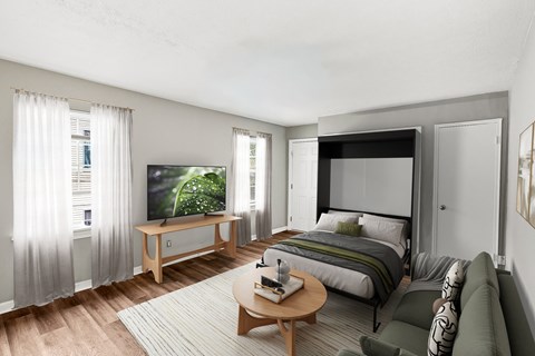 A modern bedroom with a large bed and a television.