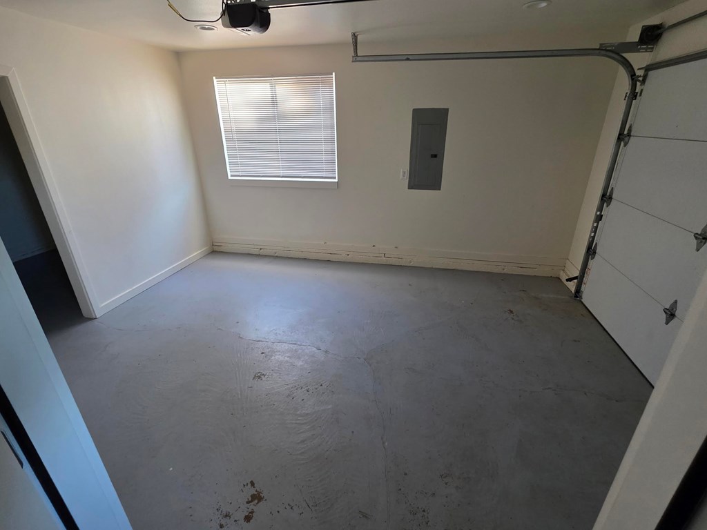 A room with a window and a door.