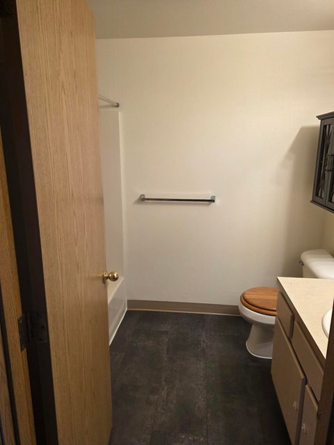 A small bathroom with a toilet and a sink.