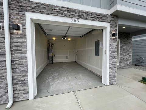 A garage with the number 763 on the wall.