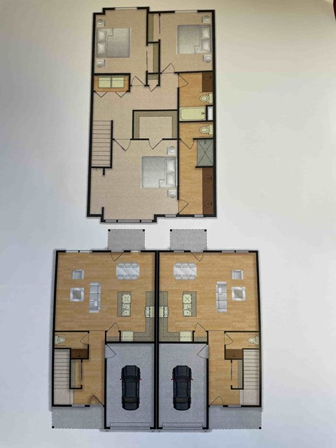 A floor plan of a two-story residential building with two bedrooms and two bathrooms on the second floor.