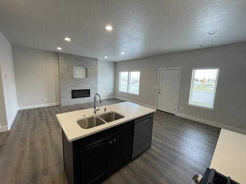 A kitchen with a sink and a countertop.