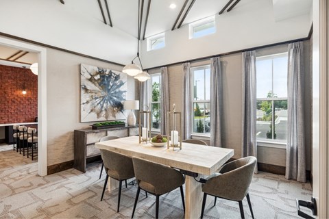 Community conference room with a large table and ample natural light.