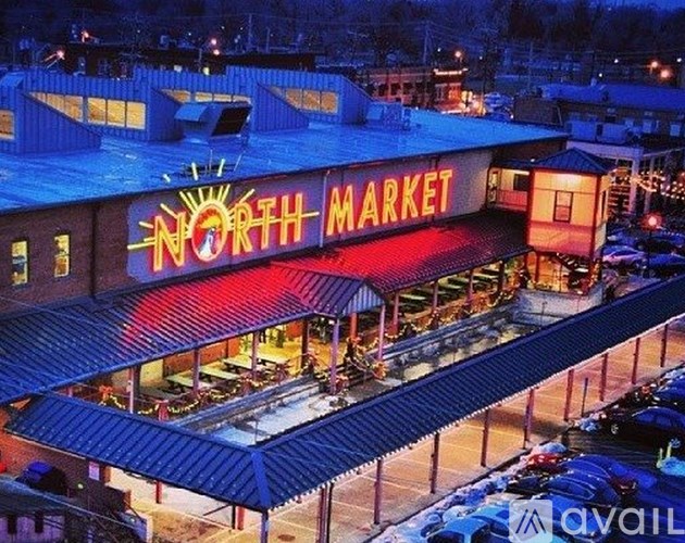 The North Market building is lit up at night.