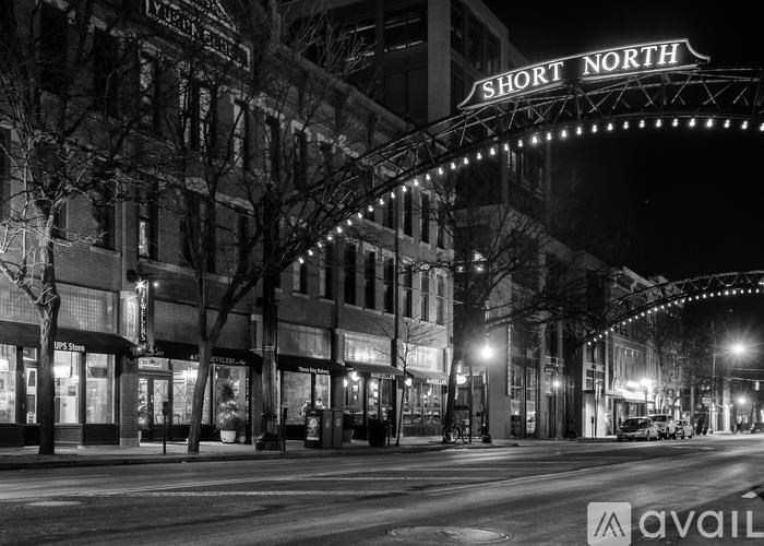 A black and white image of a street with a sign that reads "Short North".